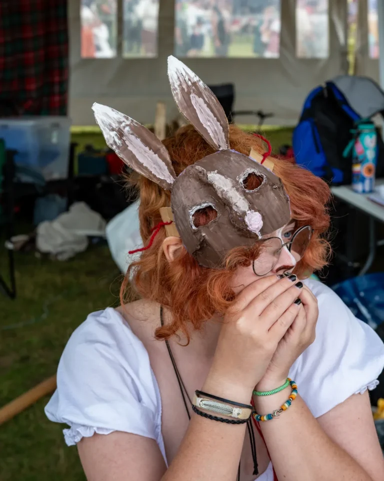 A red-haired guest in a hand-made rabbit mask